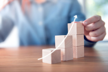 Hand arranging wood cube stacking as step stair. Business concept growth success process, copy...