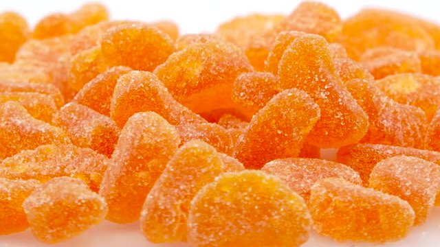 Bunch of Orange Gummies in 4k 3840 x 2160 Rotating Loop-able 360 Degree Rotation