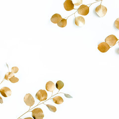 Borders of the frame of gold branches, eucalyptus leaves on a white background. flat layout, top view