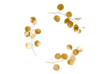 Gold round frame made of gold branches eucalyptus and leaves isolated on white background. lay flat, top view