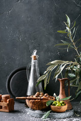 Green olives in wooden bowl