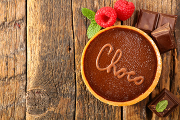 chocolate pie on wood background