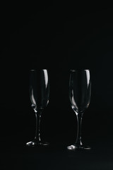 two glasses on black background