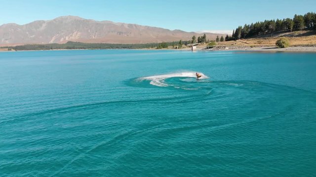 SLOWMO - Jet Ski on Beautiful Turquoise Blue Water - Lake Tekapo, New Zealand - Aerial
