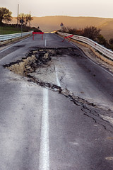 Asphalt road destroyed by the landslide 