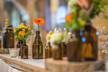 wedding table with floral arrangement prepared for reception, wedding, birthday or event centerpiece 