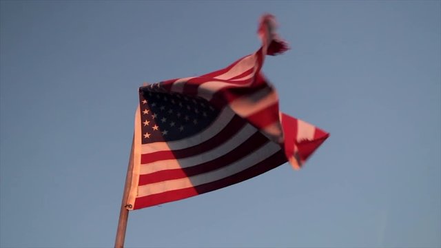 American Flag Blowing In The Wind. Red White And Blue Stars And Stripes Waving In The Wind