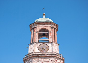 Ruins of ancient bell tower with chimes