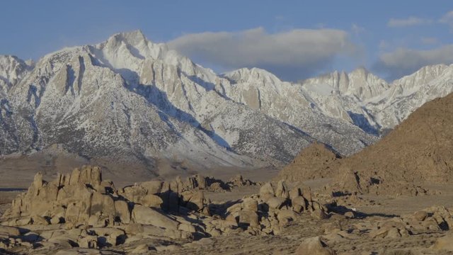 Sunrise over the Sierra mountain range in California with a snow covered Mt Whitney in the background