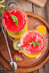 Smoothies with fresh fruit. Strawberries, apricots, kiwi.