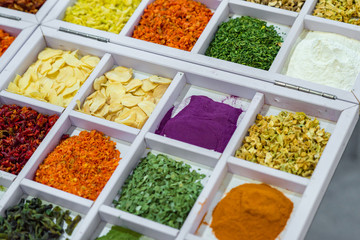 Dried vegetables in wooden box, onions, beets, carrots, pumpkin, bay leaf. Superfoods, herbs.