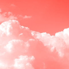 Air clouds tinted in trendy coral color