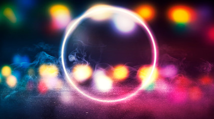 Background of empty stage, room. Reflection on wet pavement, concrete. Neon blurry lights. Neon circle figure in the center, smoke
