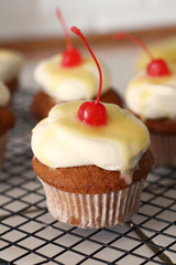 Homemade bakery style vanilla delicious sponge cake with white cream frosting and yellow lemon syrup curd  with cherry on top. Candy bar for celebrating partys and birthdays