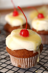 Homemade bakery style vanilla delicious sponge cake with white cream frosting and yellow lemon syrup curd  with cherry on top. Candy bar for celebrating partys and birthdays