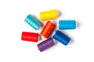 Coloured threads isolated on white background.