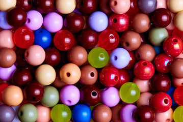 Background texture of multi-colored beads close-up.