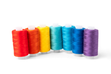 Coloured threads isolated on white background.