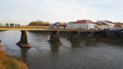 People walking on the bridge in spring
