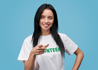 Confident volunteer pointing at camera
