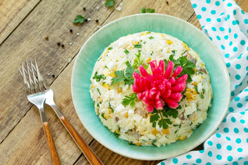 Festive snack on Easter table. Salad with Rice, Onion, Egg, Corn and Mushrooms on table. Copy space.