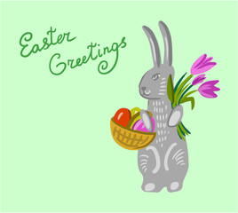 Easter bunny holding a basket with big paschal eggs