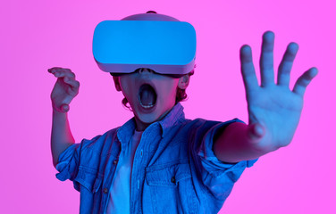 Kid exploring virtual reality in neon lights 