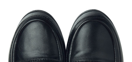 Black leather shoes on white background