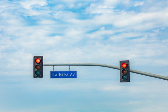 Street Name La Brea Avenue In Hollywood With Red Traffic Light