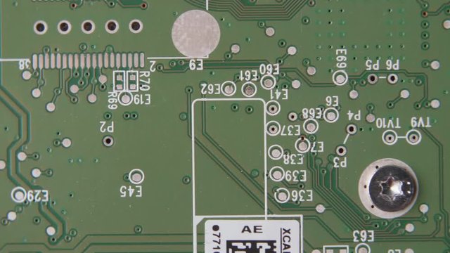 Cicuit Board with Lettering and Pins CLOSE UP PAN LEFT