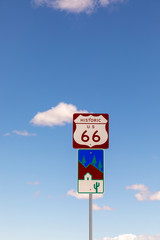 Route 66 sign under clear blue sky