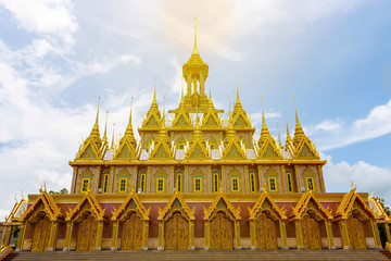 Amazing Thailand, Golden sanctuary Architecture statues walls churches arches at Wat Tha Sung on blue sky