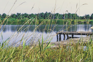 Fototapeta premium Fishing platform on the lake. Wooden pier.