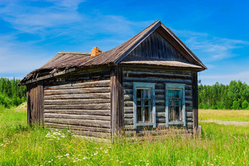 Fototapeta premium old wooden house in the village on a summer day