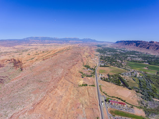 US Route 191 and La Sal Mountains aerial view near Arches National Park, Moab, Utah, USA.