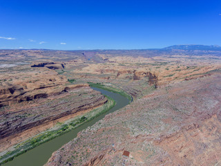 Aerial view of Colorado River and La Sal Mountains near Arches National Park in Moab, Utah, USA.