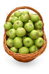 green apples in basket isolated on white background, top view
