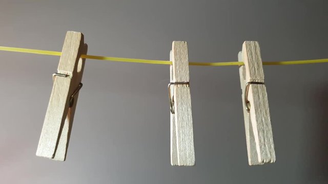The Clothes pegs made of wood. Wooden clothes pegs