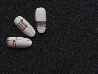 Stylish design on tips. Macro texture of nails.