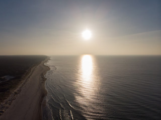 Curonian Spit and the Baltic Sea. View from the copter. Coastline with the beach and the sea. Nature conservation. View from the sky. The photo was taken by drone quadcopter.