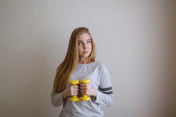 student doing exercises with dumbbells,home sports