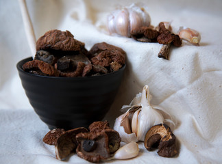 dried mushrooms with garlic in a black Cup