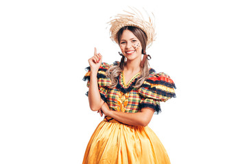 Brazilian woman wearing typical clothes for the Festa Junina showing something isolated on white...