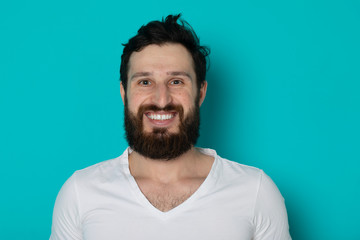 Fototapeta premium Portrait of cheerful smiling bearded man