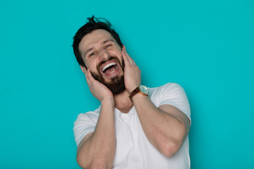 Portrait of cheerful smiling bearded man