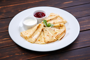 pancakes with sour cream and berry sauce