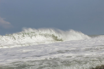 wave breaking on rocks