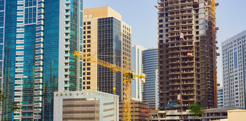Fototapeta na wymiar modern buildings in construction. Dubai, United Arab Emirates