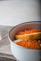 caviar sandwiches in a metal container