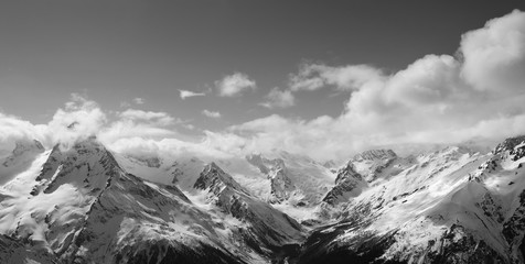 Black and white panorama of sunlight mountains in cloud